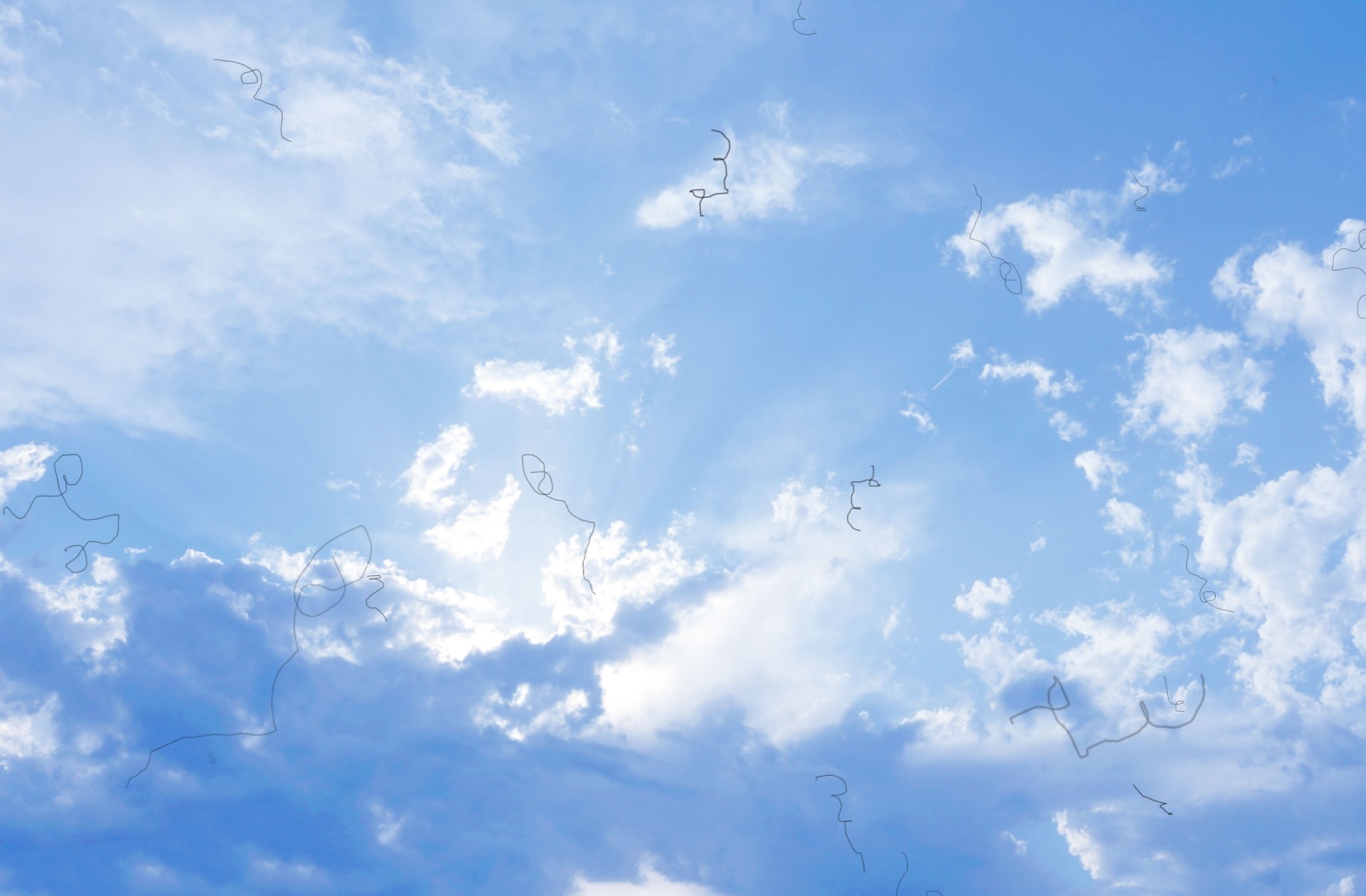 A photo of a cloudy, blue sky, with eye floaters drifting in the field of view.