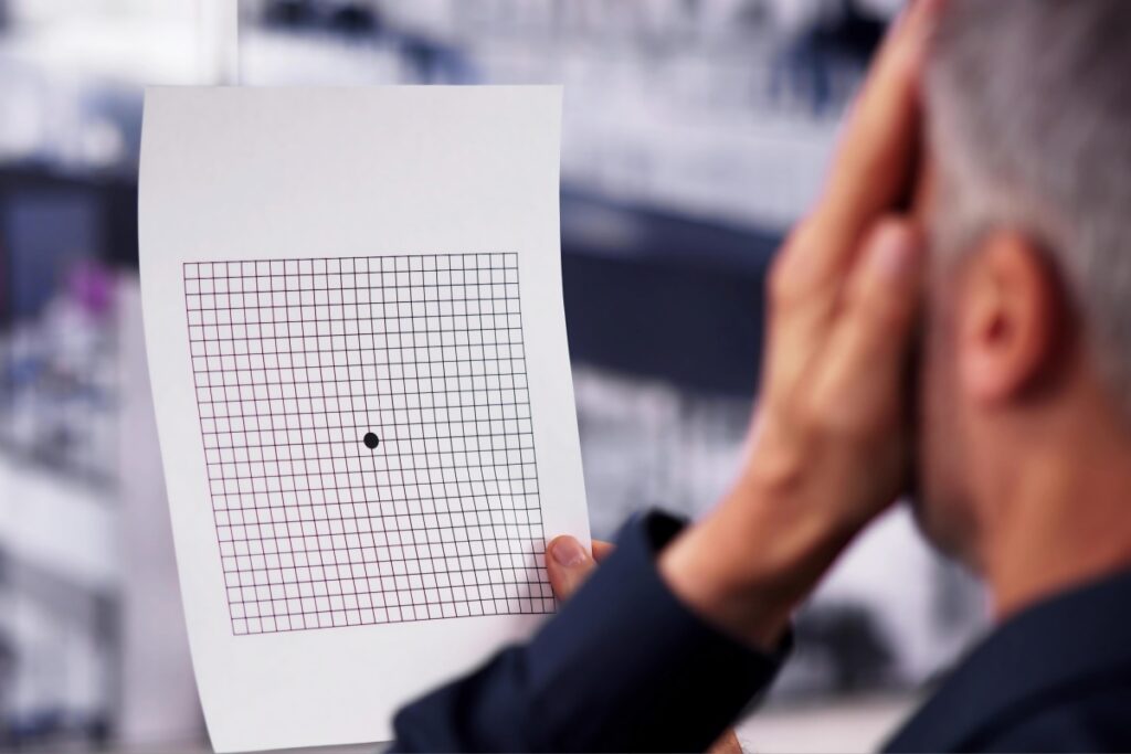 Man using amsler grid on himself
